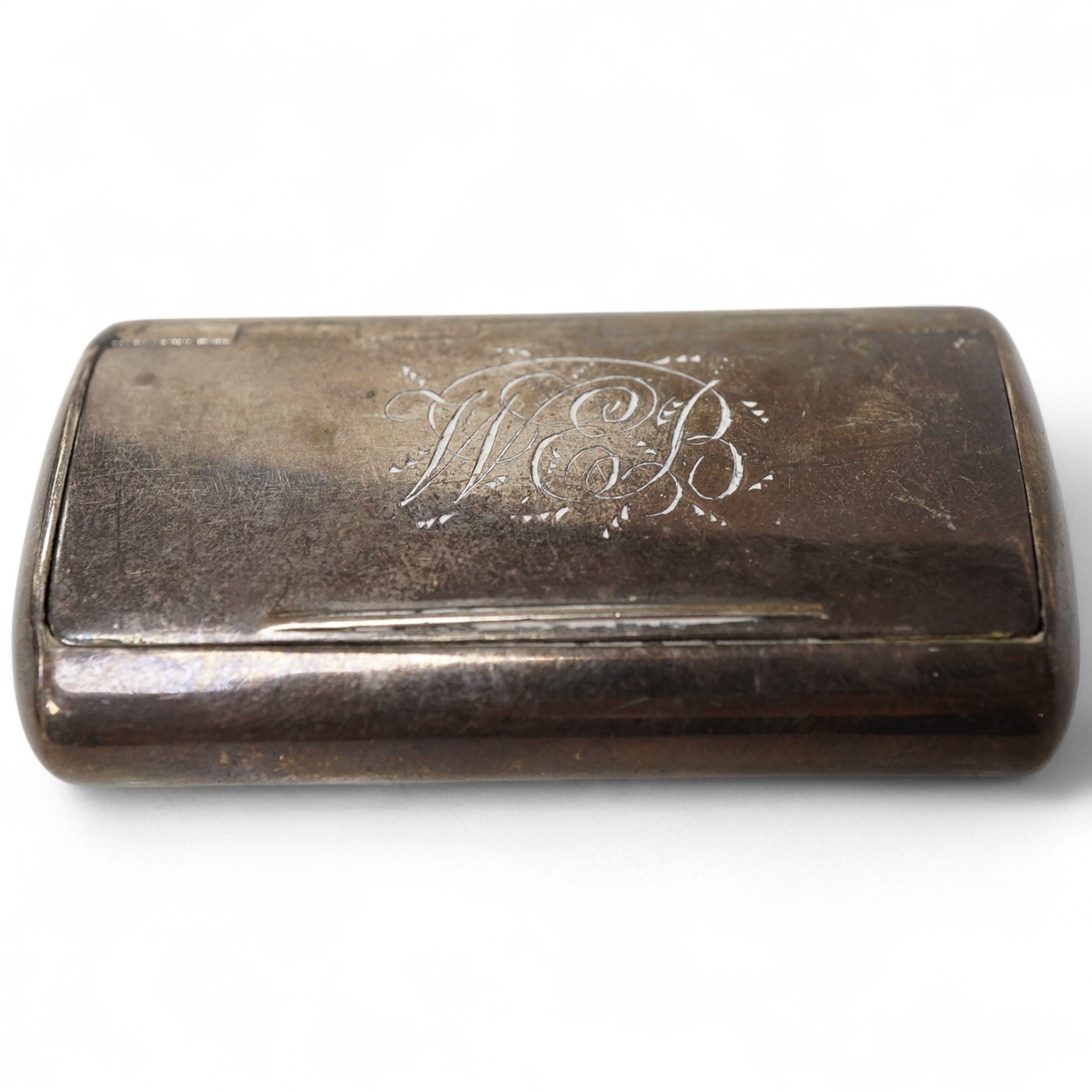 A George III silver ovoid snuff box, with engraved monogram, Samuel Pemberton, Birmingham, 1804, 59mm.